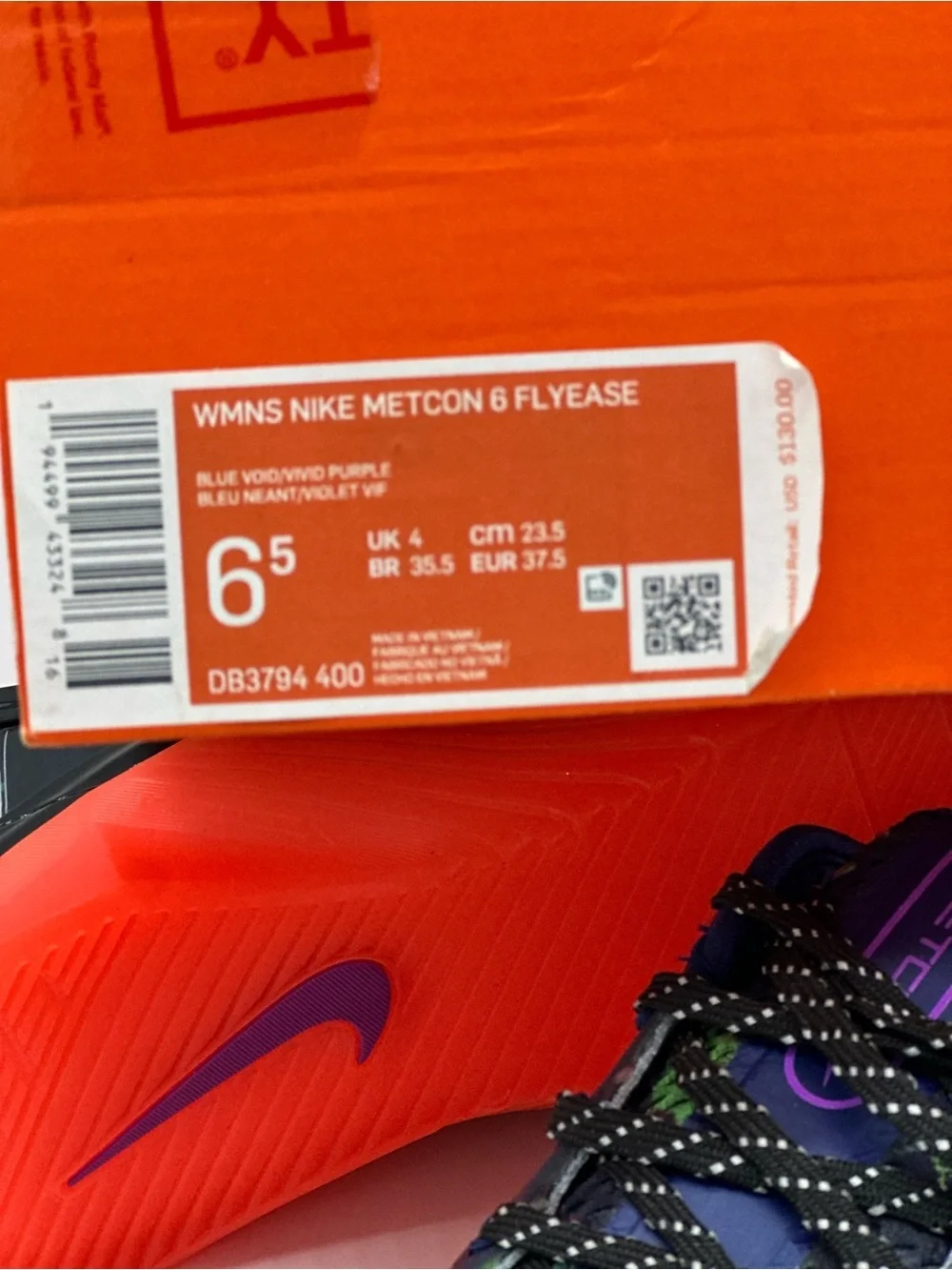 Nike Women's Multicolor Knit Sneakers with Purple Swoosh and Bright Orange Sole